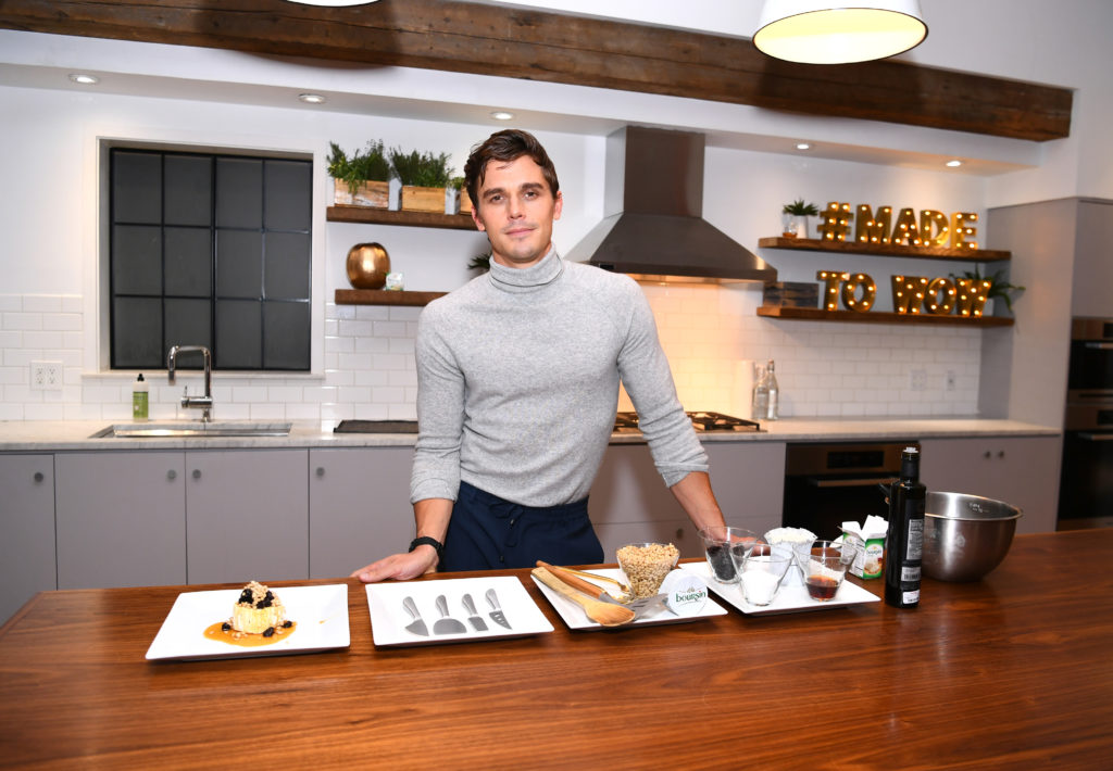 Antoni Porowski, who has become the subject of one of many Queer Eye memes, demonstrates preparing a signature dish as he attends Boursin Friendsgiving at Home Studios on November 7, 2018 in New York City.
