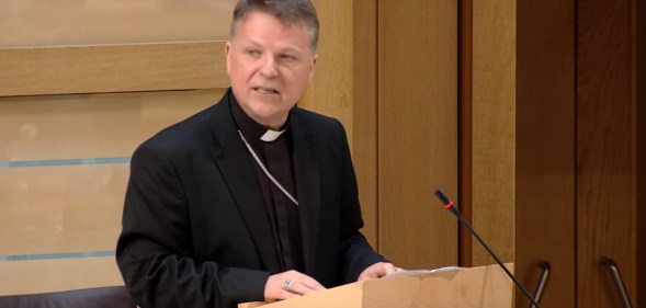 Bishop John Keenan, head of the Diocese of Paisley in Scotland, addresses the Scottish Parliament