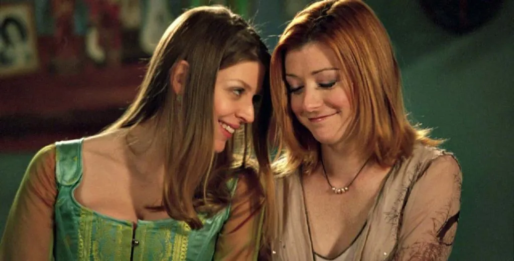Tara (left) and Willow were the first lesbian couple to share a kiss on TV in Buffy the Vampire Slayer. (20th Century Fox)