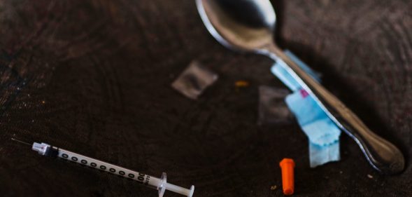 A needle, spoon, and narcotics bag are seen near a heroin encampment in the Kensington neighborhood of Philadelphia, Pennsylvania, on April 10, 2017. In North Philadelphia, railroad gulch as it is knowen, is ground zero in Philadelphia?s opioid epidemic. Known by locals as El Campanento, the open air drug market and heroin encampment is built with the discarded materials from the gulch and populated by addicts seeking a hit of heroin to keep their dope sick, or withdrawal symptoms, at bay. In one area, near the 2nd Avenue overpass, empty syringe wrappers blanket the refuse like grass the used needles they once contained poking through like thistles. According to the city Health Commission, Philadelphia is on track to see 33 percent more drug overdose deaths in 2017 over last year. / AFP PHOTO / DOMINICK REUTER (Photo credit should read DOMINICK REUTER/AFP/Getty Images)