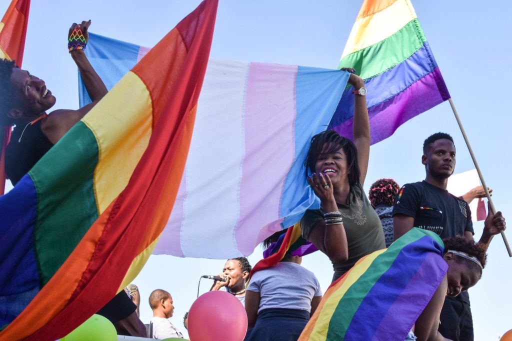 Dozens of people cheer and dance as they take part in the Namibian Lesbians, Gay, Bisexual and Transexual (LGBT) community pride Parade in the streets of the Namibian Capitol on July 29, 2017 in Windhoek. Even though there have been marches and protests against discrimination against the LGBT community in the past years, this is the first time that the community held such a parade along the capital's main street, Independence Avenue, to celebrate their identity and rights. / AFP PHOTO / Hildegard Titus (Photo credit should read HILDEGARD TITUS/AFP/Getty Images)