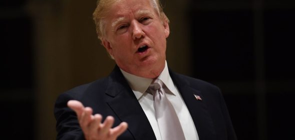 US President Donald Trump speaks to reporters at Trump International Golf Club in West Palm Beach on January 14, 2018. / AFP PHOTO / Nicholas Kamm (Photo credit should read NICHOLAS KAMM/AFP/Getty Images)