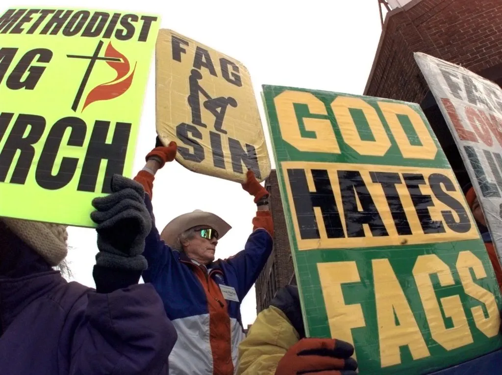 Rev. Fred Phelps from the Westboro Baptist Church of Topeka, Kansas holds a 'God Hates Fags' sign