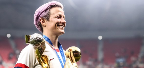 Megan Rapinoe with world cup trophy