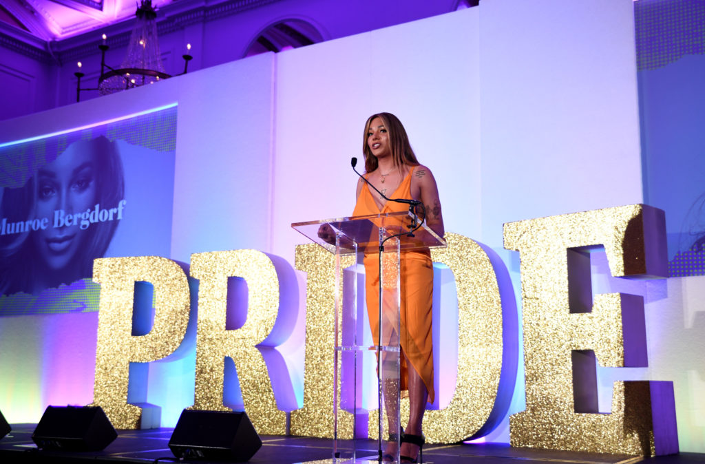 Munroe Bergdorf speaking in front of life-size Pride letters