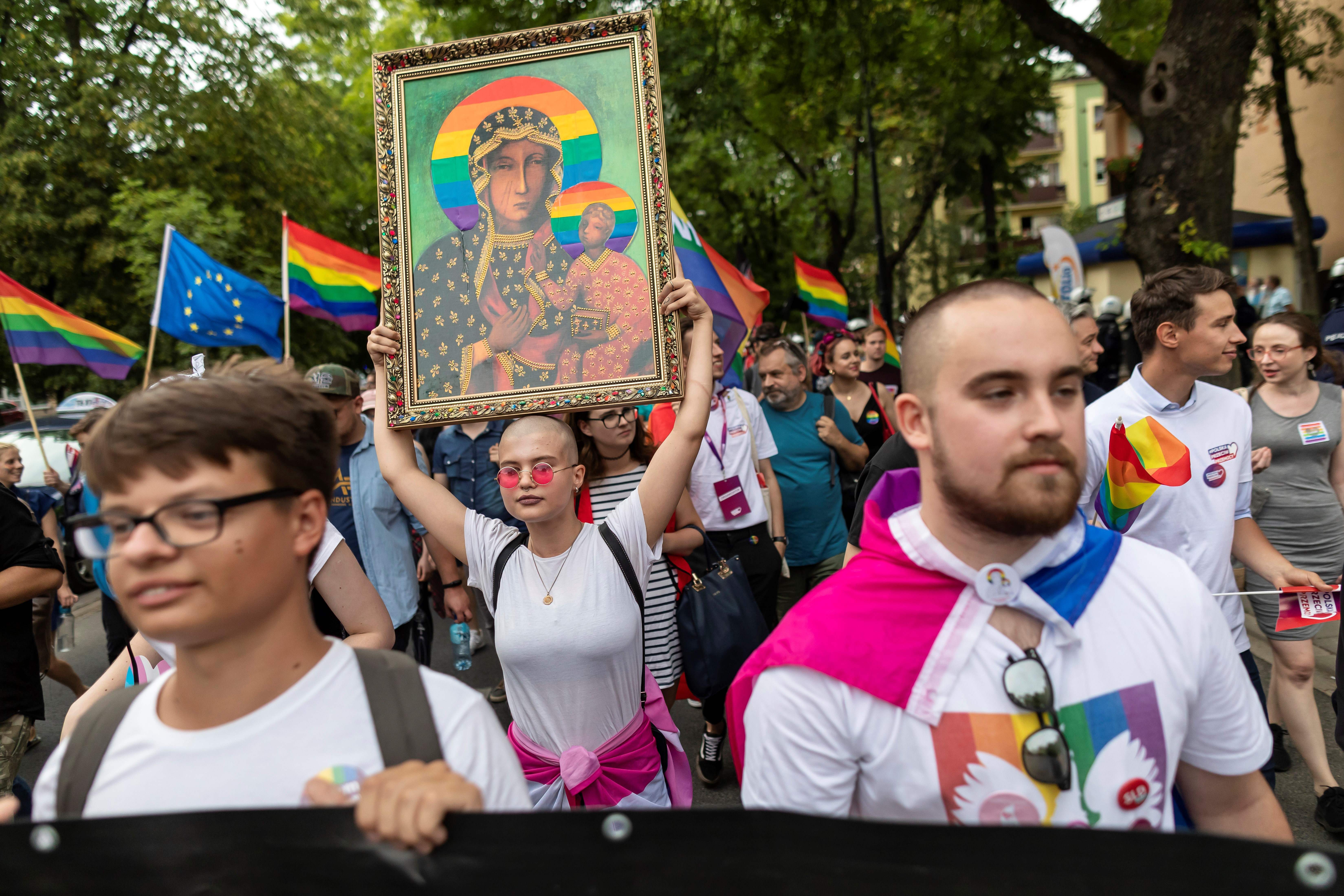 Poland plock equality parade blocked by teenager with crucifix