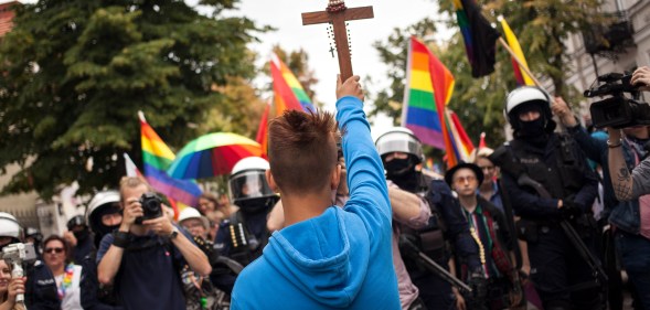 Poland plock equality parade blocked by teenager with crucifix