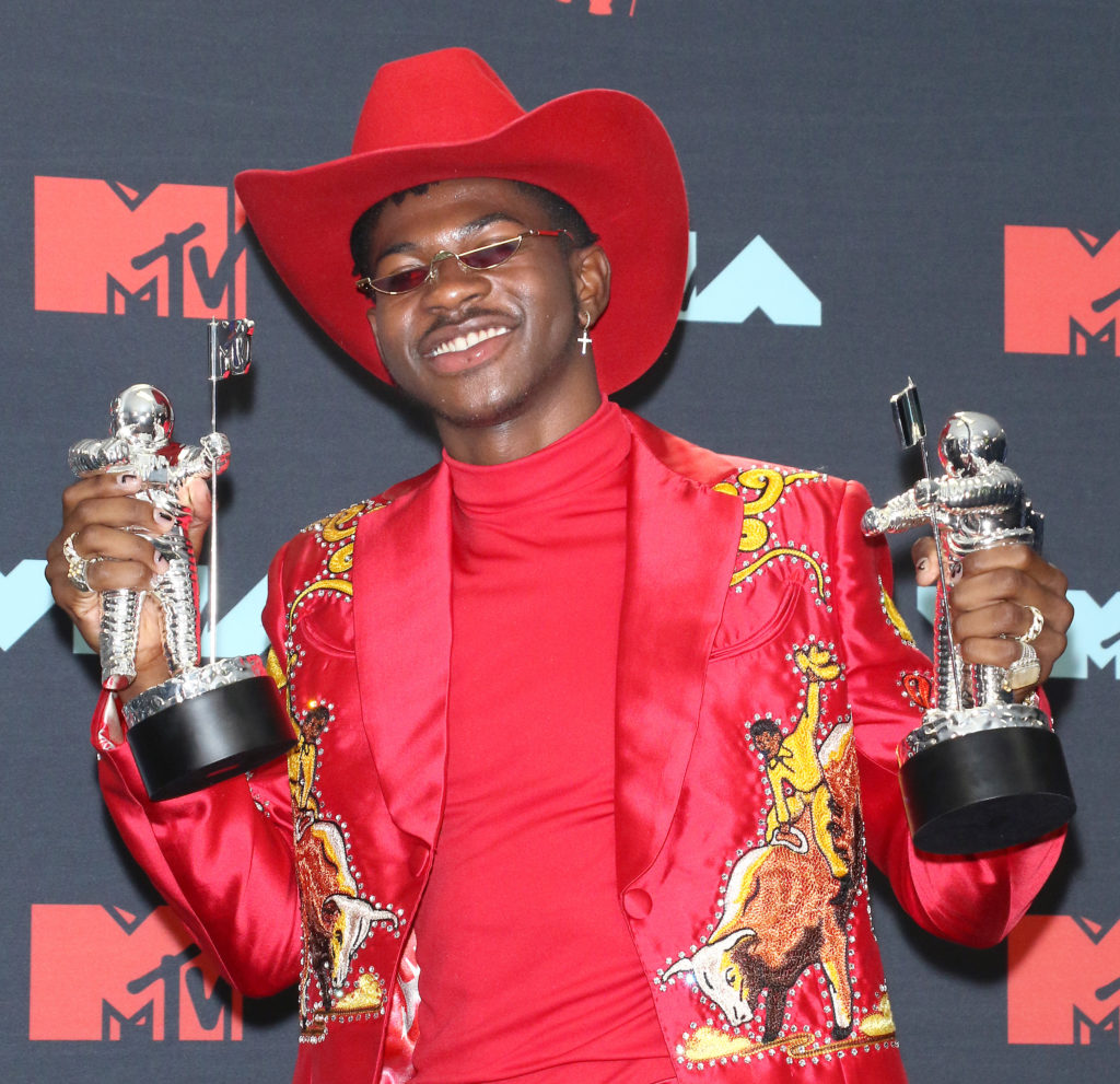 Lil Nas X holding his VMA Awards
