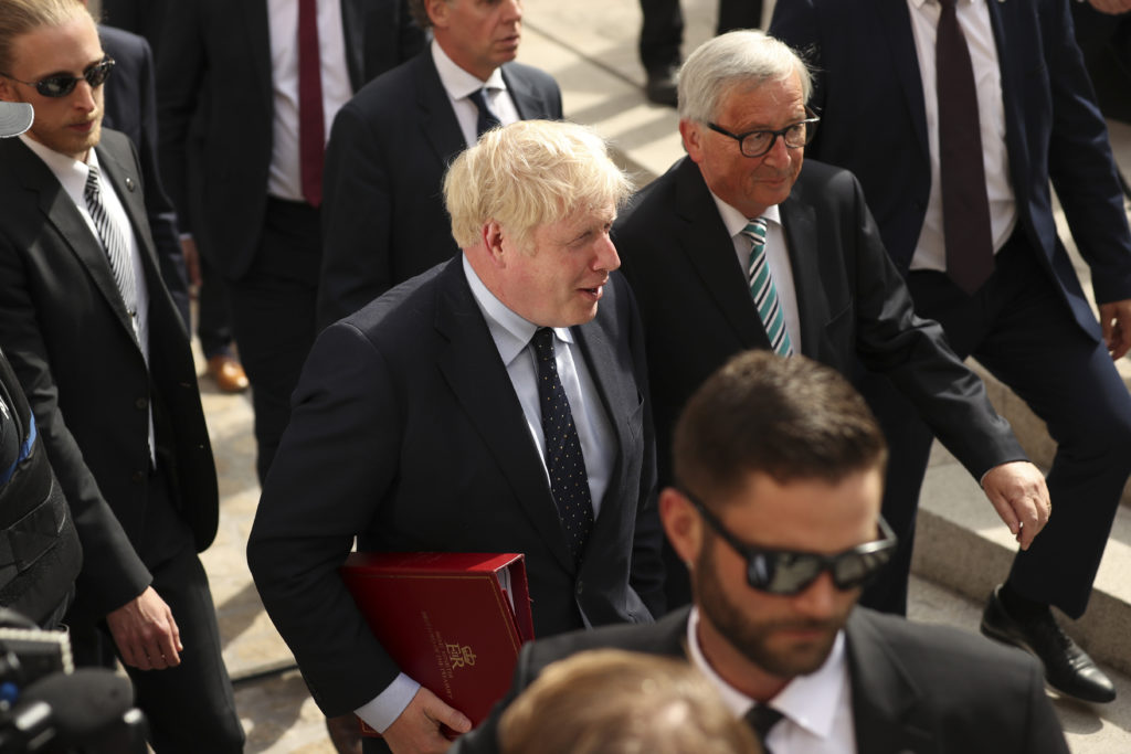 European Commission President Jean-Claude Juncker (R) poses with British Prime Minister Boris Johnson prior to a meeting at a restaurant. (Francisco Seco - Pool/Getty Images)