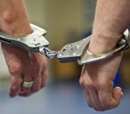 A prisoner's hands in handcuffs