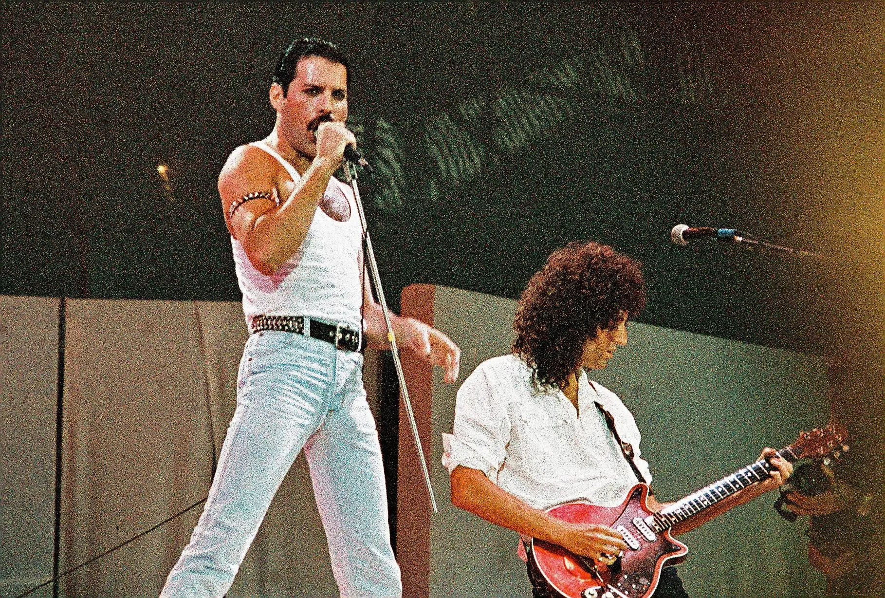 Freddie Mercury performing on stage 