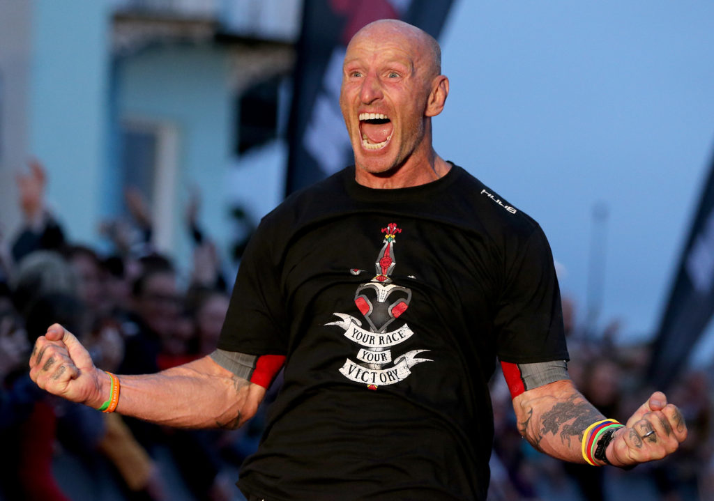 Gareth Thomas with cheering with his arms outstretched