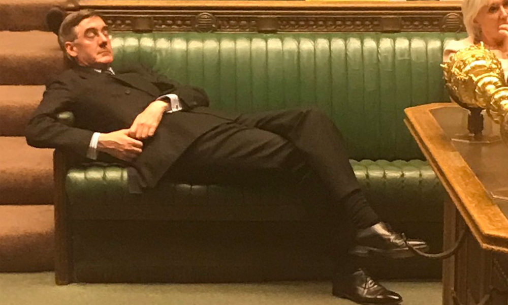 Jacob Rees-Mogg reclining in parliament