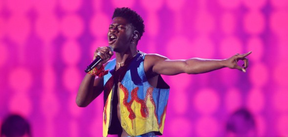 Lil Nas X in a flame print vest