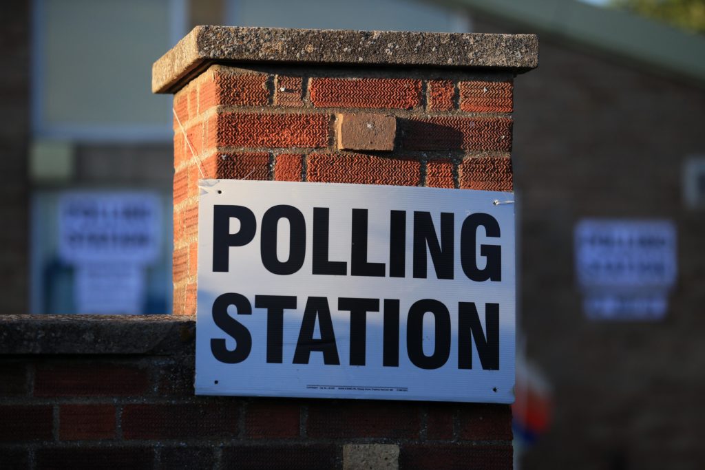 Brits will brave bitterly cold temperatures in two weeks to vote. (LINDSEY PARNABY/AFP via Getty Images)