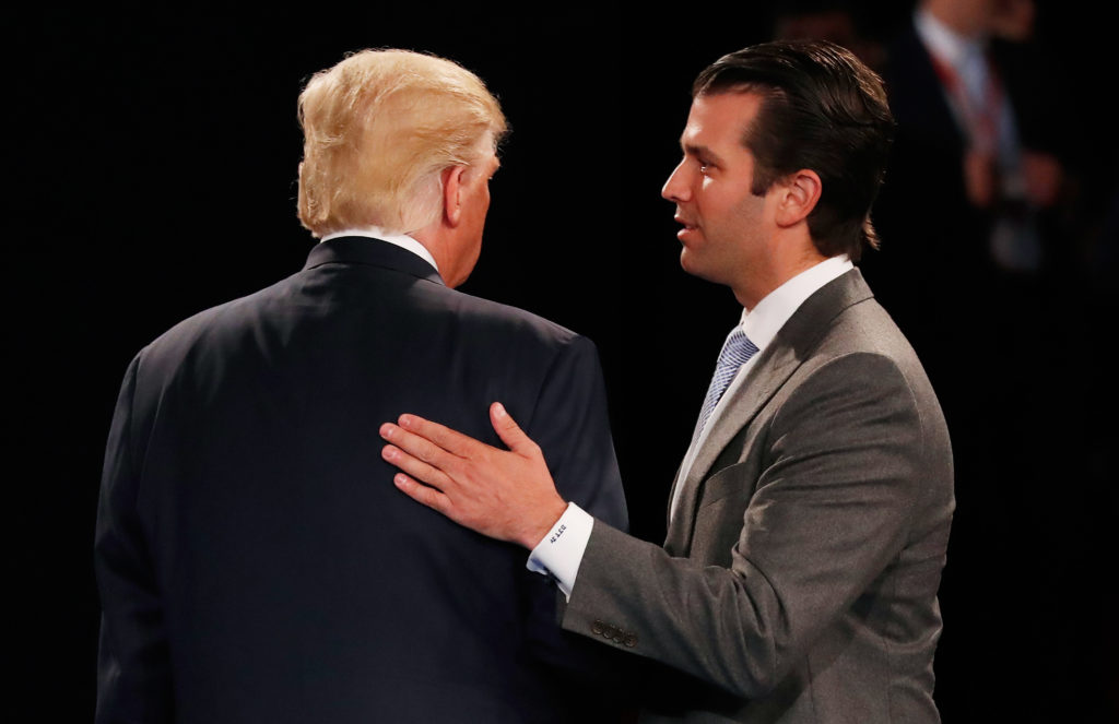 Donald Trump, Jr. (R) greets his father Donald Trump. (Rick Wilking-Pool/Getty Images)