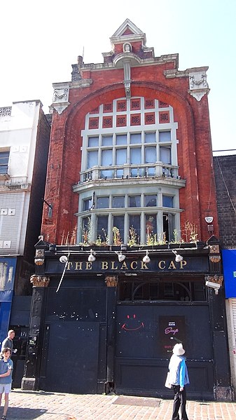 The front façade of the Black Cap, boarded up in 2018. (Wikimedia Commons)