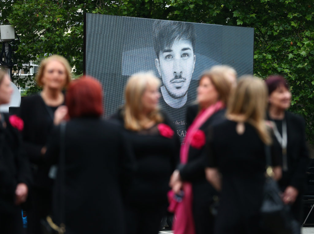 A screen displaying an image of Martyn Hett outside Stockport Town Hall as mourners arrive for his funeral. (Dave Thompson/Getty Images)