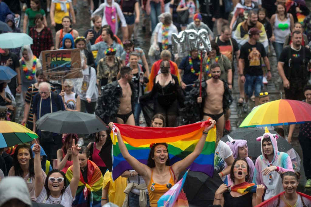 People hold placards and rainbow flags during the ninth LGBT+ Pride event in the Czech capital Prague on August 10, 2019. (MICHAL CIZEK/AFP via Getty Images)