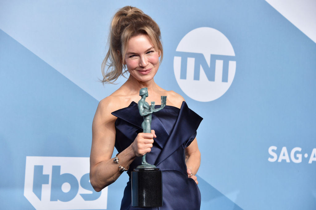 Renee Zellweger poses in the press room with the trophy for Best Performance by an Actress in a Motion Picture - Drama for "Judy" during the 26th Annual Screen Actors Guild Awards 