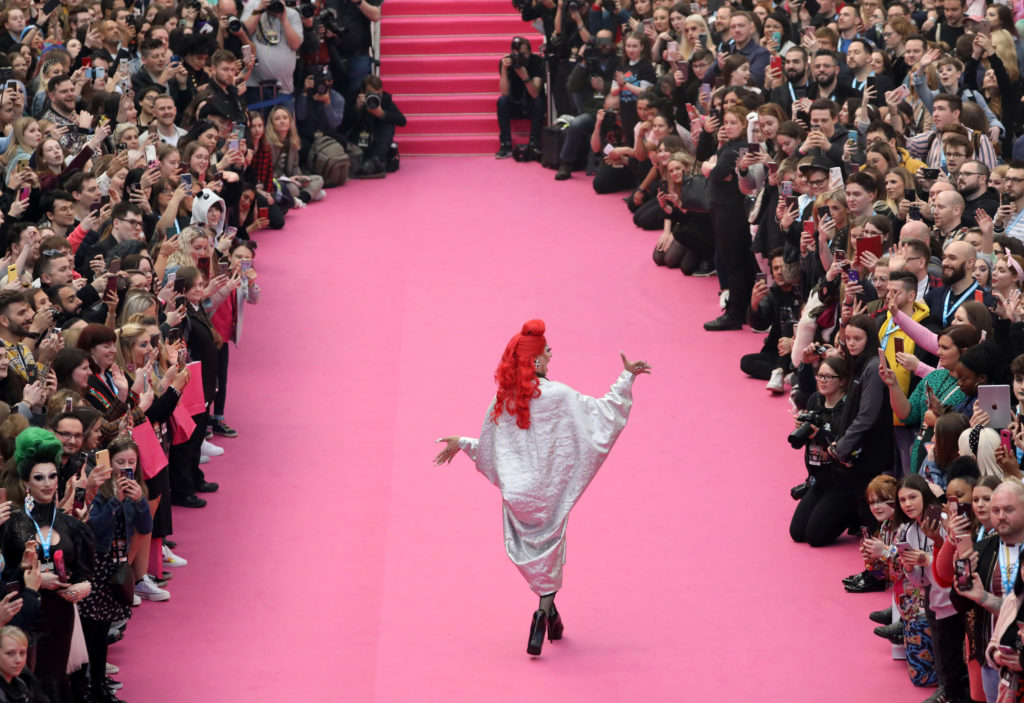 Divina De Campo walking the DragCon UK pink carpet