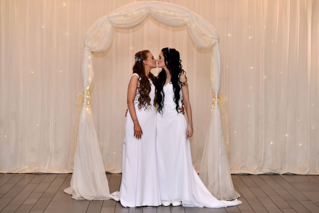 Robyn Peoples and Sharni Edwards kiss after they became the first legally married same sex couple in Northern Ireland on February 11, 2020 in Carrickfergus, Northern Ireland.