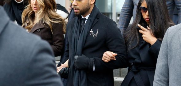 Flanked by attorneys and supporters, actor Jussie Smollett walks out of the Leighton Criminal Courthouse after pleading not guilty to a new indictment on February 24, 2020 in Chicago, Illinois.