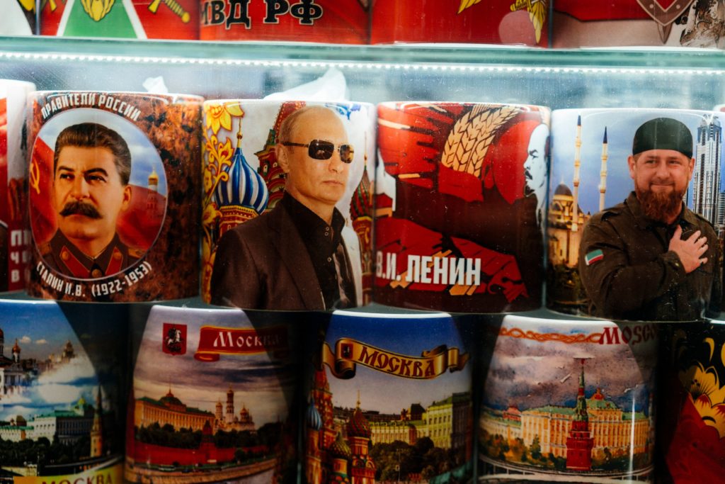 Mugs decorated with images of Russian President Vladimir Putin, Soviet leaders Joseph Stalin and Vladimir Lenin and Chechnya's leader Ramzan Kadyrov are seen on sale among other items at a gift shop in Moscow. (DIMITAR DILKOFF/AFP via Getty Images)