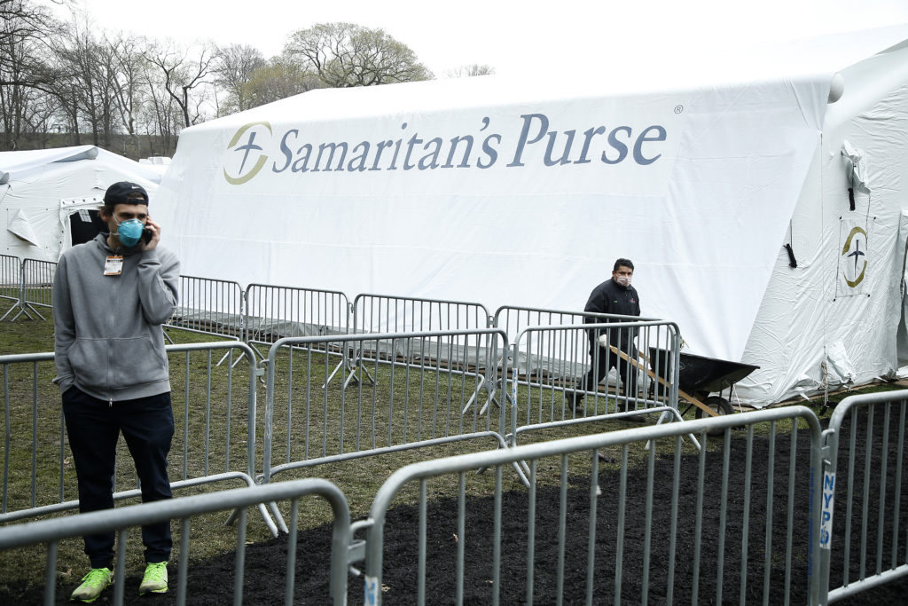 Samaritan's Purse volunteers, many from state churches, hoisted metal polls and carted crates of equipment to build a temporary coronavirus hospital. (John Lamparski/Getty Images)