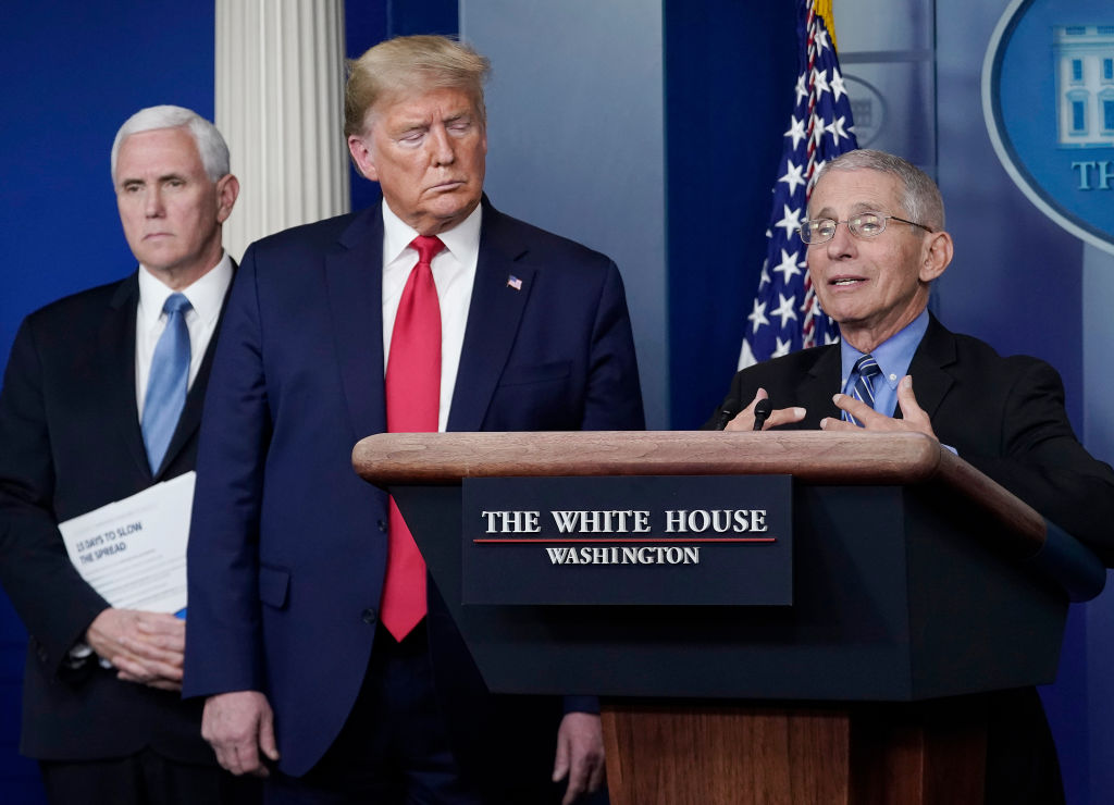 Dr. Anthony Fauci, director of the National Institute of Allergy and Infectious Diseases, speaks as President Donald Trump and Vice President Mike Pence listen