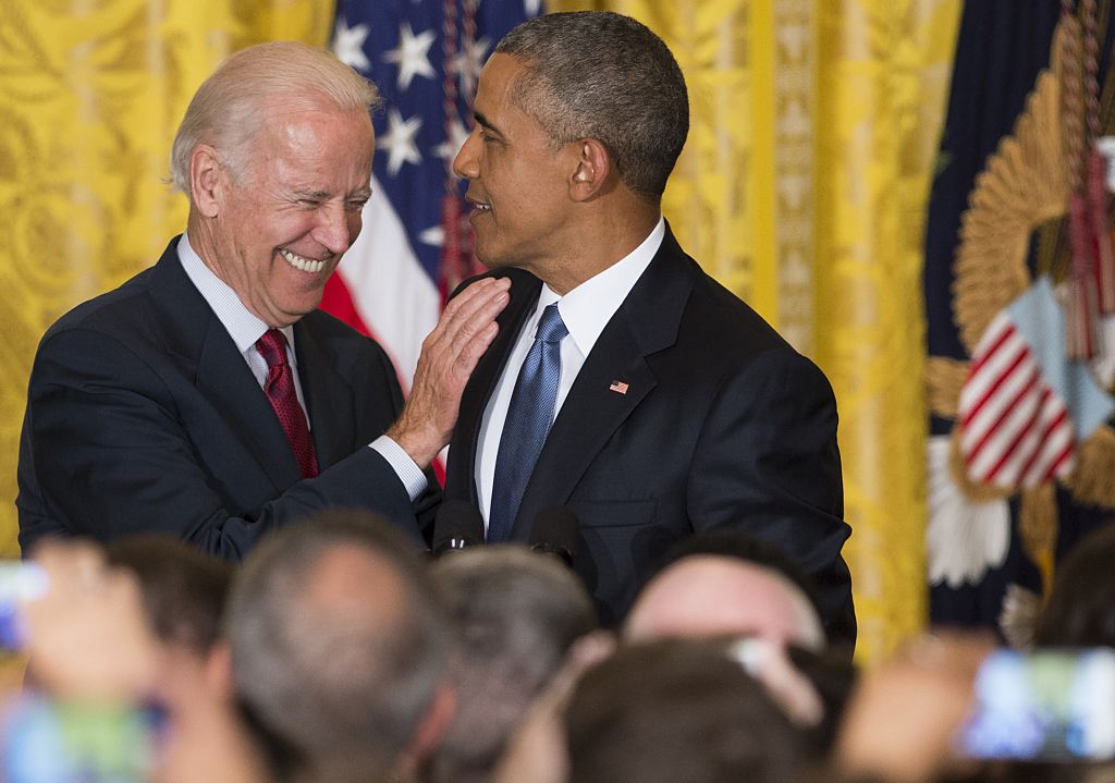 US President Barack Obama and US Vice President Joe Biden attend a reception in honor of LGBT Pride Month in the East Room of the White House in Washington, DC, June 24, 2015.