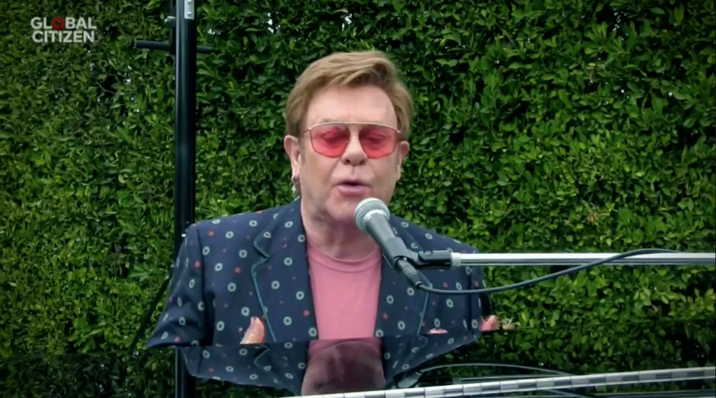 Elton John playing piano 