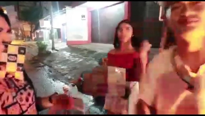 Two trans women were handed instant noodle boxes by a YouTuber in Indonesia. Inside them were rotting vegetables and stones. (Screen capture via YouTube)