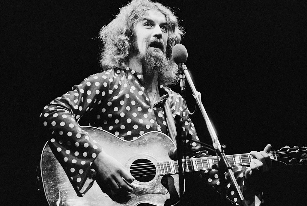 Scottish comedian and folk singer Billy Connolly performing in 1975.