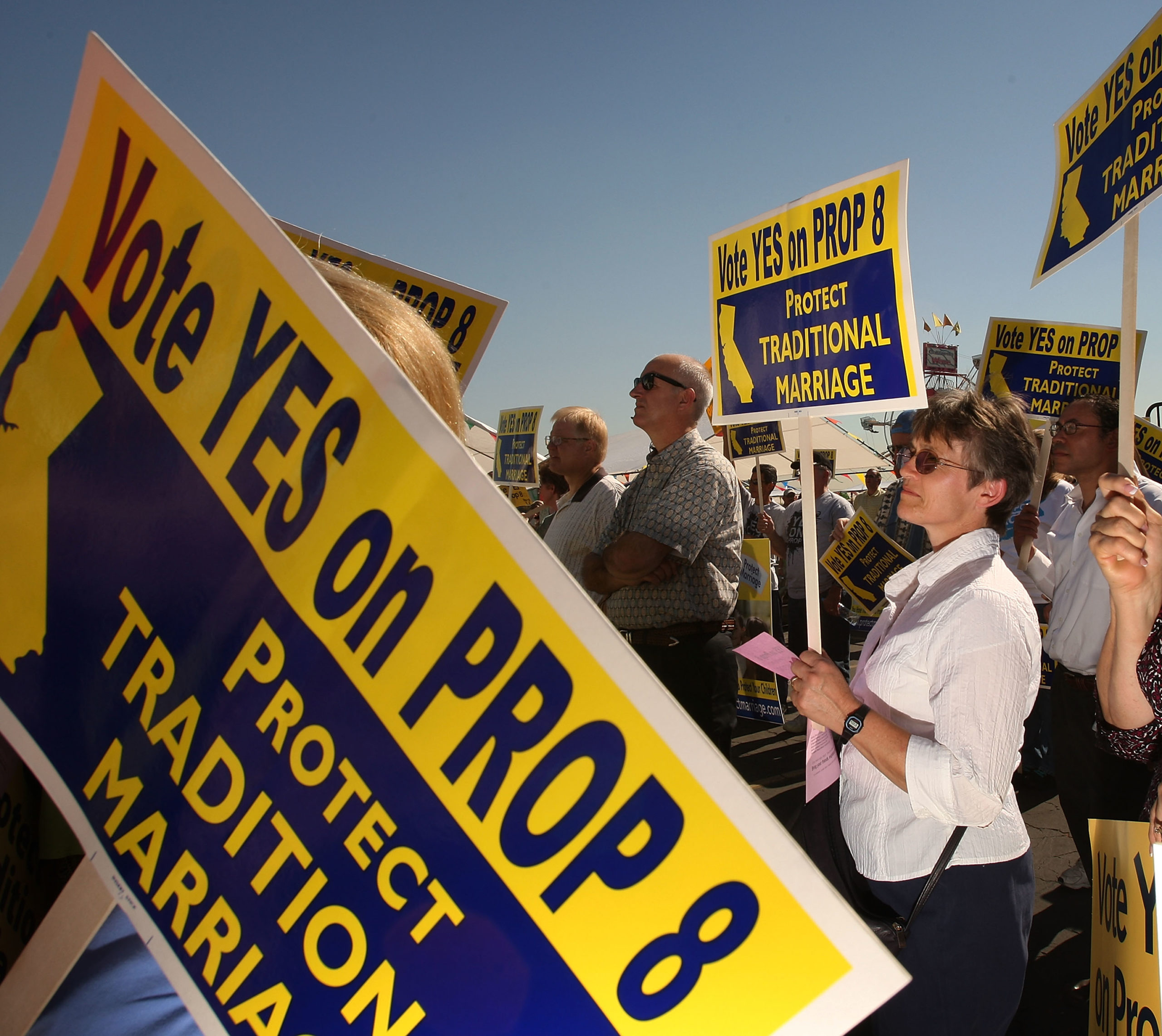 Supporters of Proposition 8, which would outlaw same-sex marriage throughout California, rally during a 'Yes on 8 bus tour in Los Angeles, California. 
