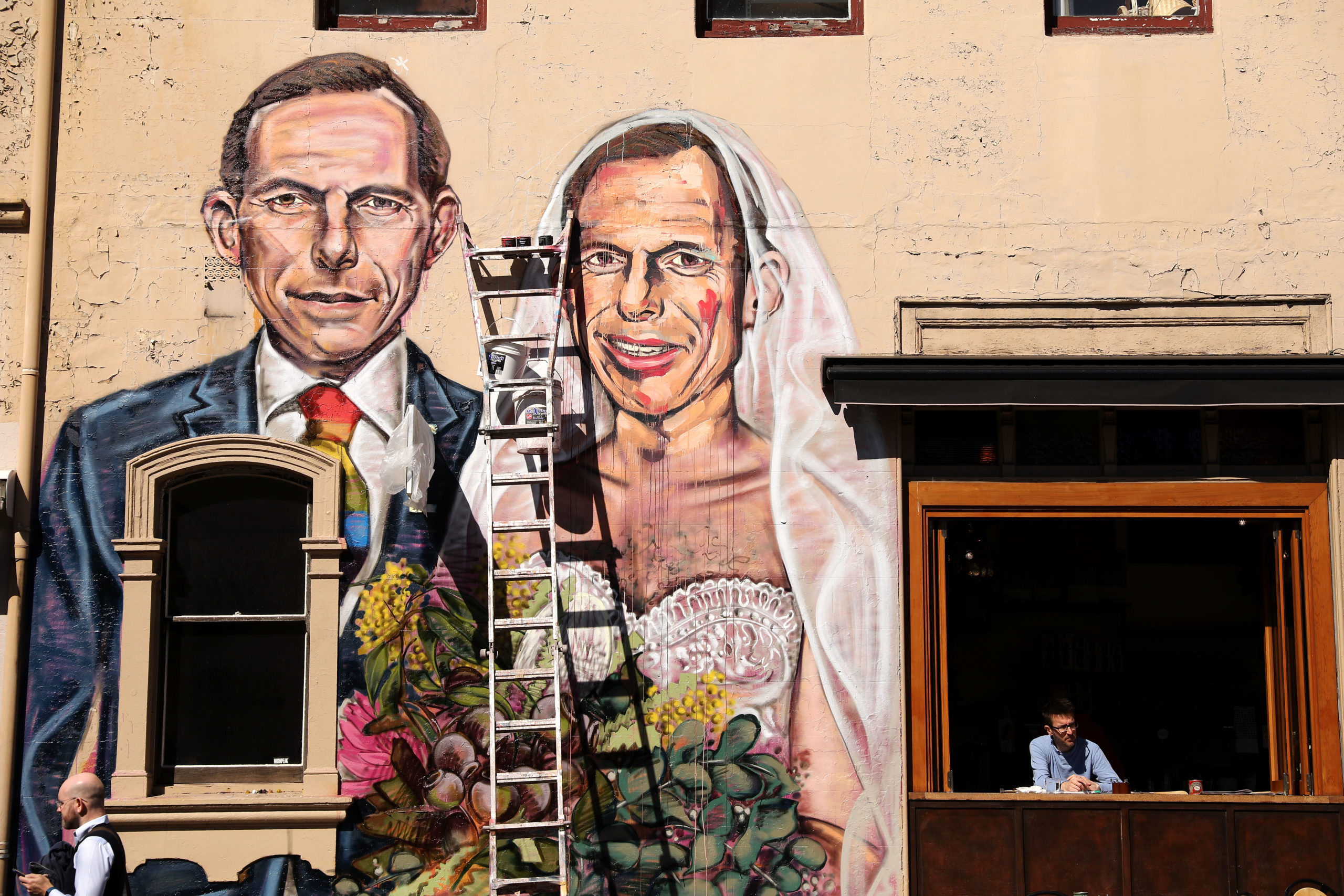 A mural by artist Scott Marsh depicting former Prime Minister Tony Abbott marrying himself 