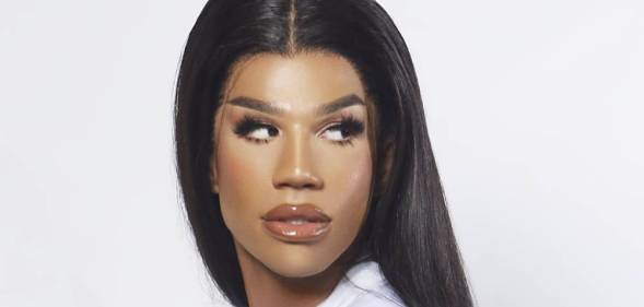 A tight crop of Naomi Smalls' face. Her hair is long, her mug is beat, her eyes looking to the right