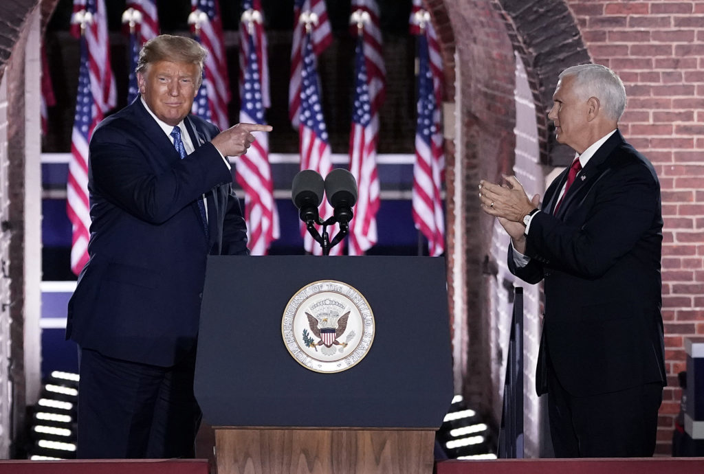 Donald Trump pointing at Mike Pence on stage