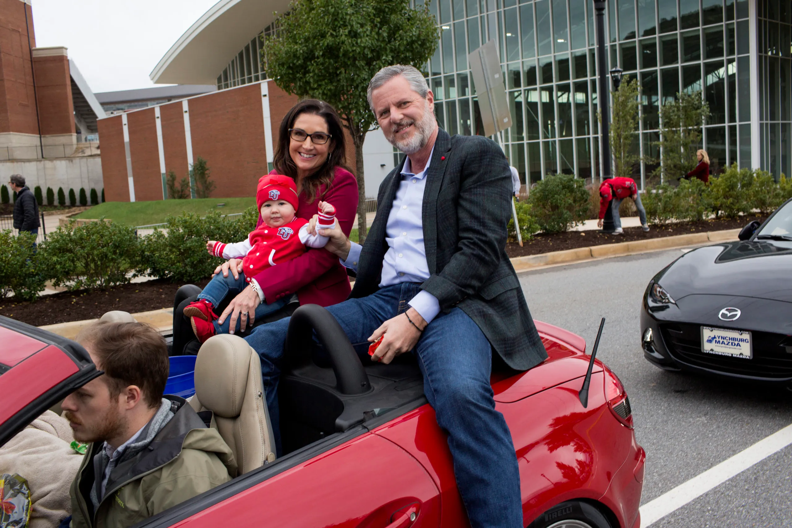Then-President of Liberty University Jerry Falwell Jr. rides with his wife Becki and a grandchild in the school's annual homecoming weekend parade on October 20, 2018 in Lynchburg, Virginia. 