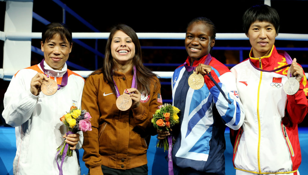 Nicola Adams, Marlen Esparaza and their two fellow Olympic champions holding medals at London 2012