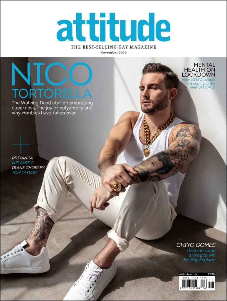 Nico Tortorella on the front cover of Attitude in a white vest and white trousers, sitting against a white wall