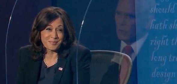 Kamala Harris smiling at Mike Pence