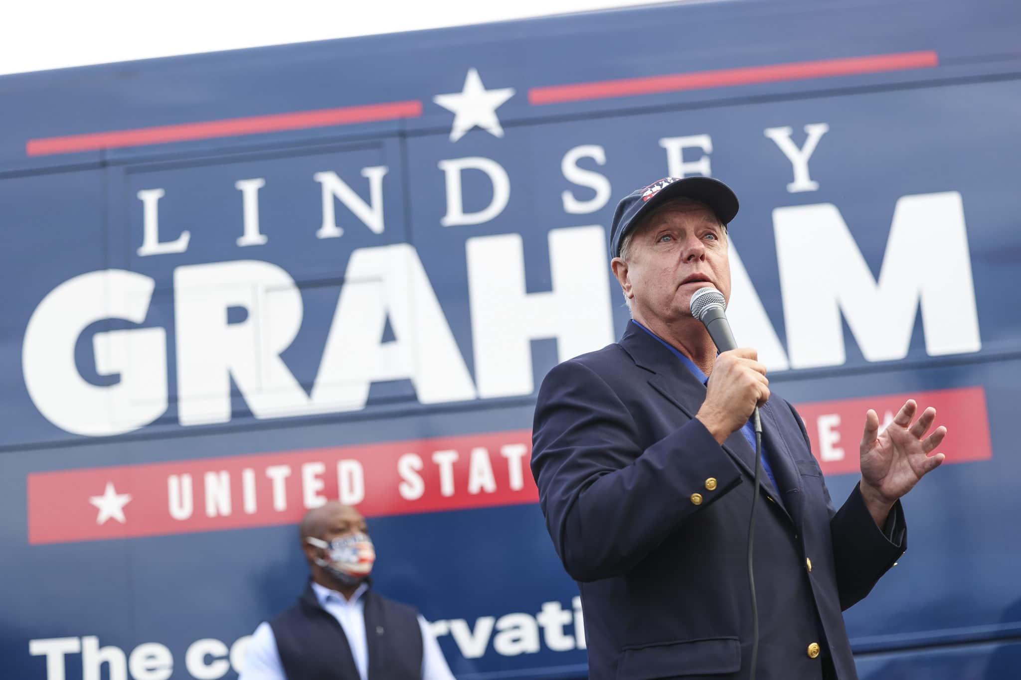 Republican senator Lindsey Graham speaks to supporters during a campaign bus tour 