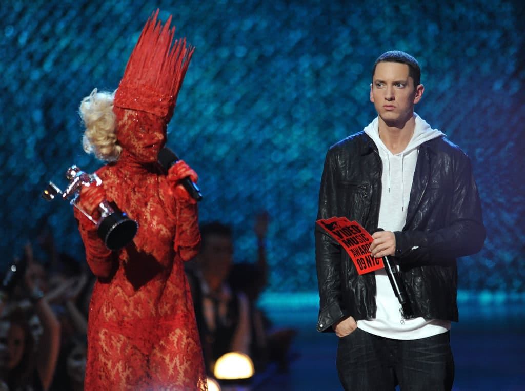Lady Gaga accepts an award onstage from rapper Eminem during the 2009 MTV Video Music Awards. (Kevin Mazur/WireImage)