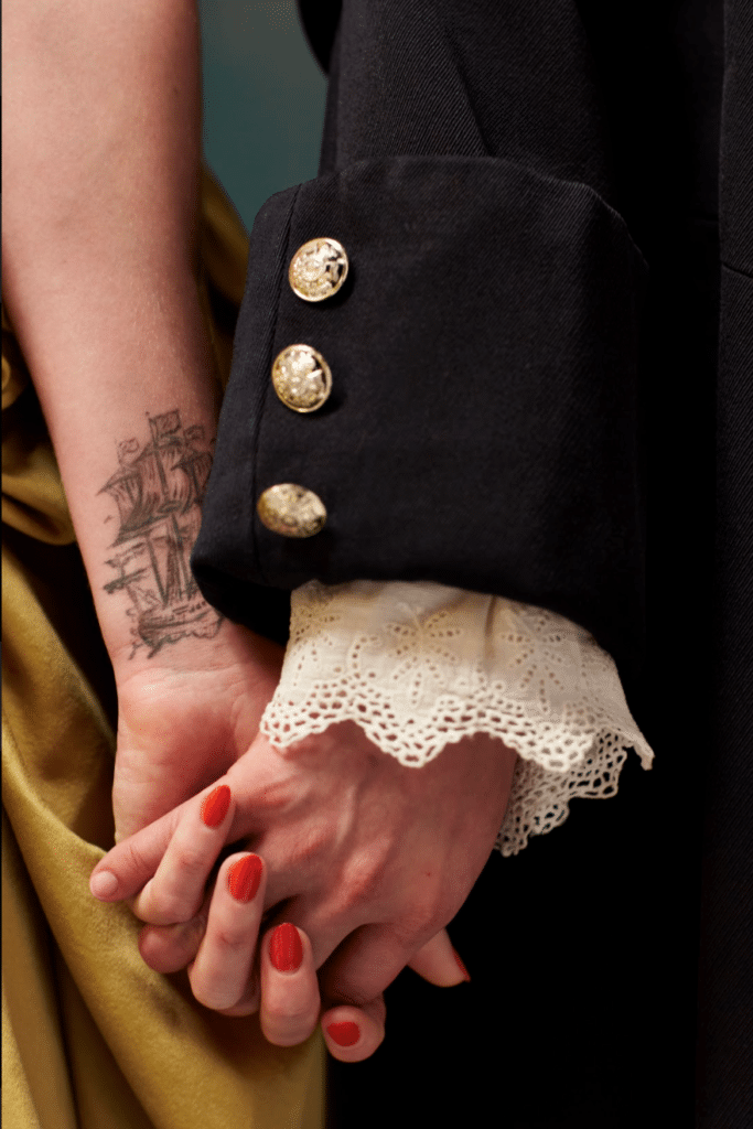 Close-up of two women holding hands