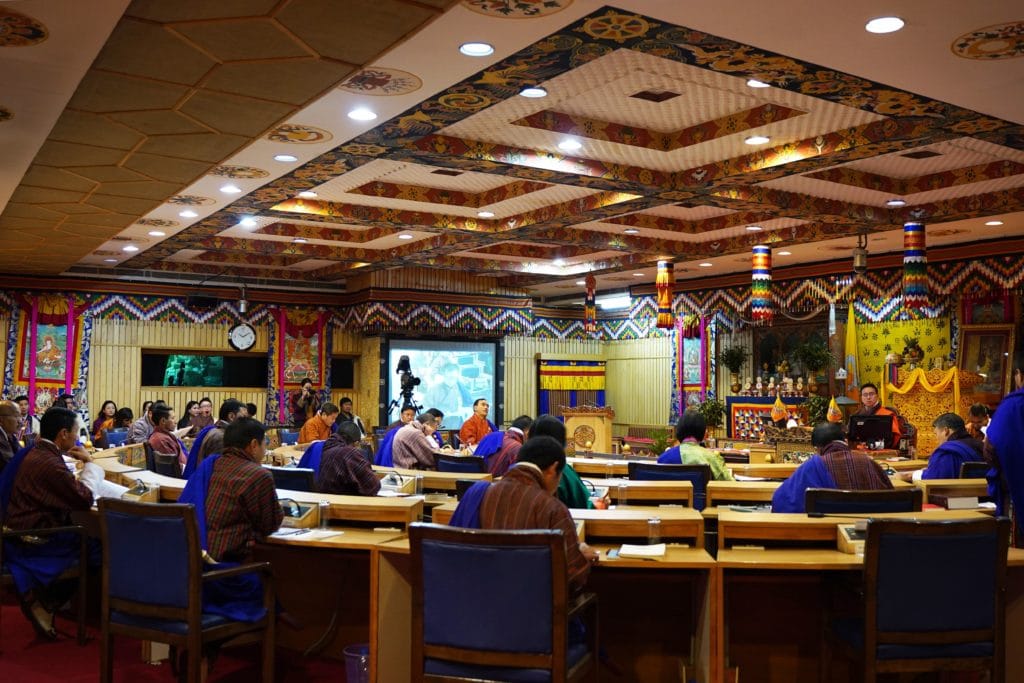 Members of the national council, Bhutan's upper house of parliament, sit in the chamber 