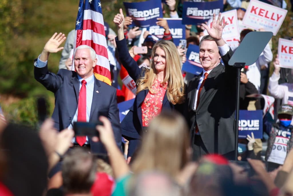 Mile Pence and Kelly Loeffler at a campaign rally 