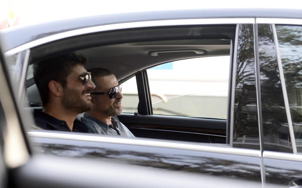 George Michael and Fadi Fawaz in the backseat of a car