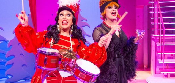 BenDeLaCreme dressed as a drummer with Jinkx Monsoon in a feather-trimmed nightgown