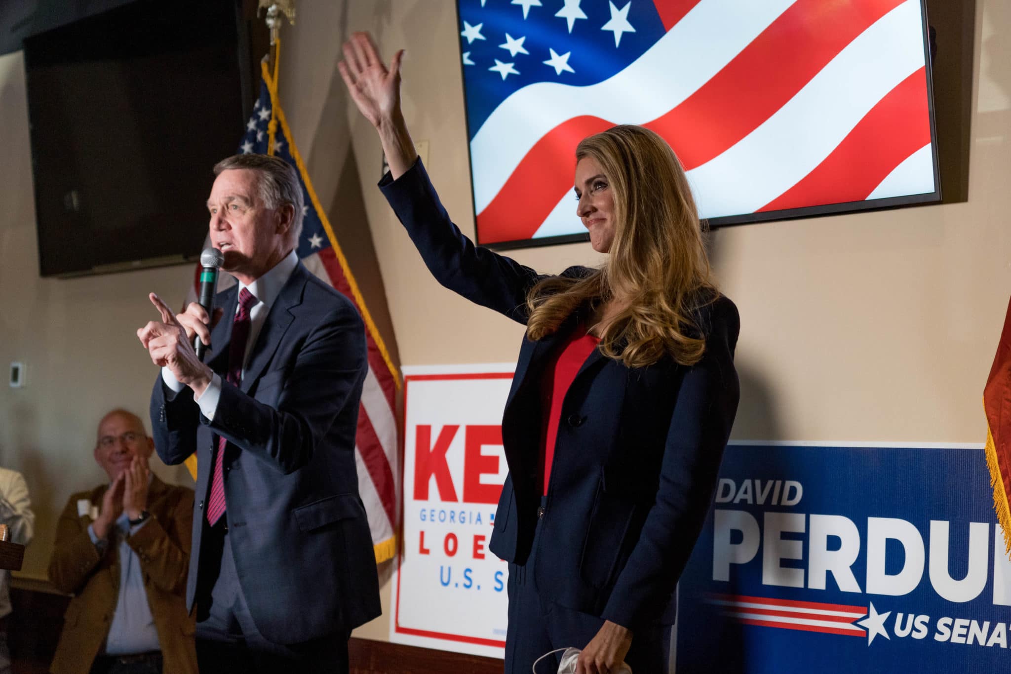 David Perdue and Kelly Loeffler speak at a campaign event